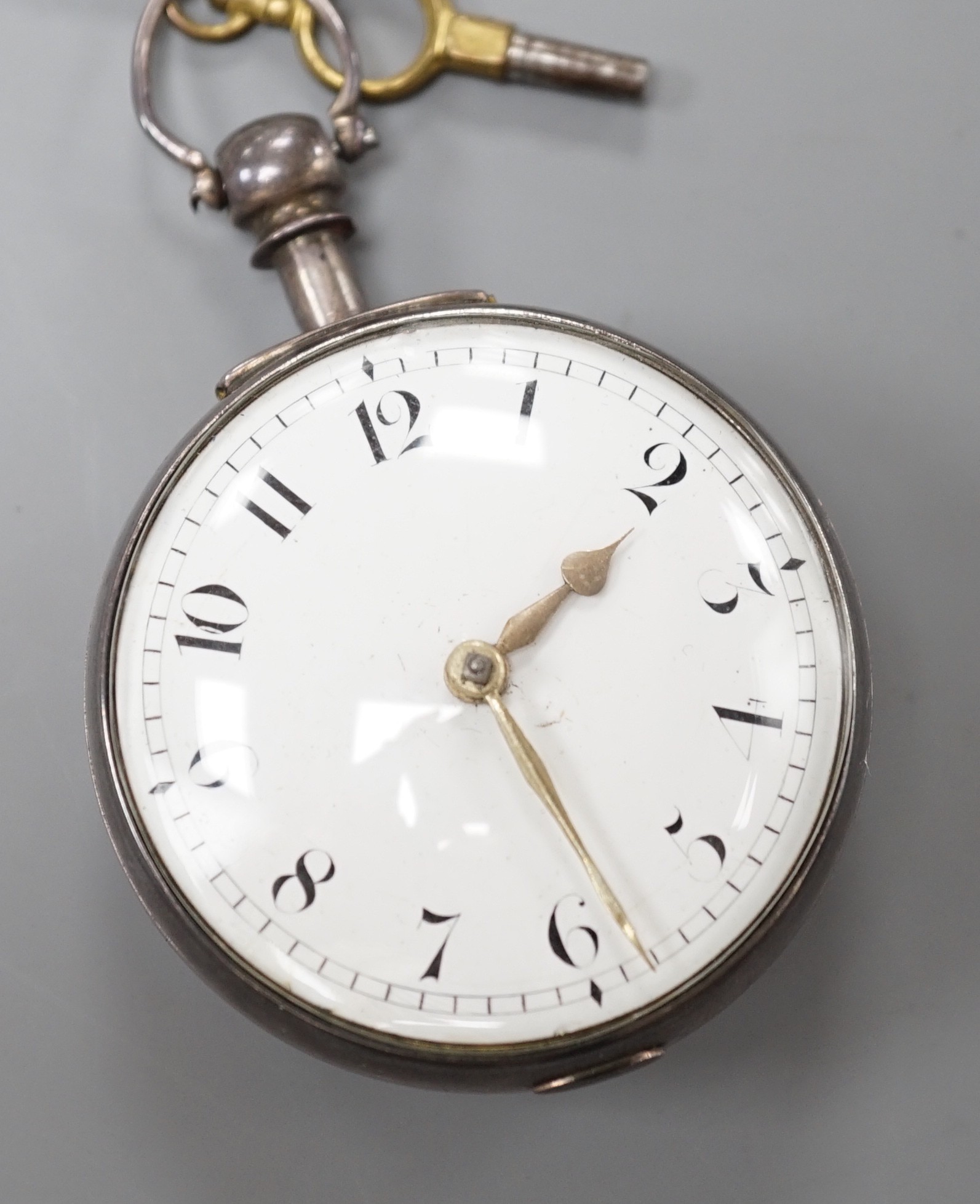 A George IV silver keywind verge pocket watch, by Tanner of Hailsham, with Arabic dial and engraved name verso, case diameter 51mm, with key, (missing outer case?).